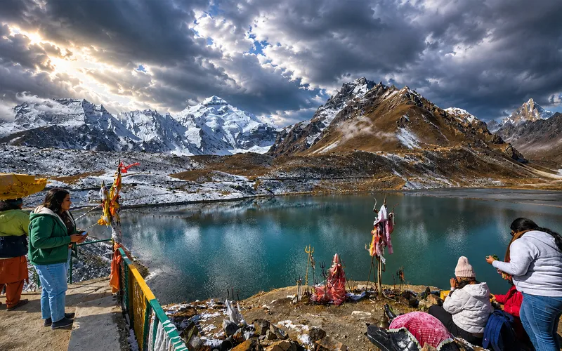 Pilgrims travelling through snow-covered Himalayan terrain on the Adi Kailash route